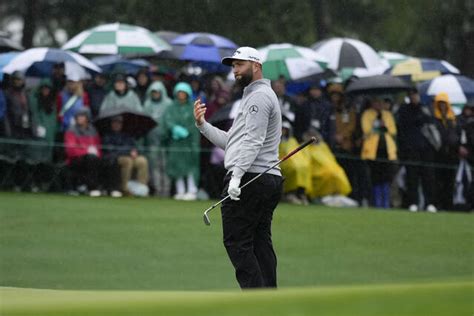 Survival at Masters as Rahm stays close and Woods makes cut
